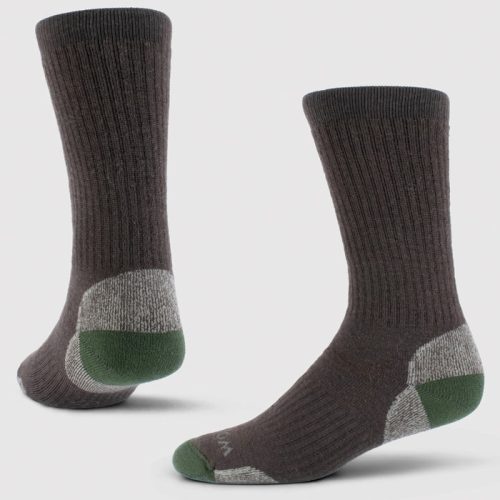 A pair of Woolx Core Crew Sock Full Cushion in French Roast, expertly crafted from moisture-wicking Merino wool, showcases contrasting green toes and gray heel accents, displayed standing upright on a light background.