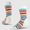 Discover the Everyday Crew Sock Light Cushion by Woolx, showcasing a natural stripe design in white with red, blue, and brown horizontal bands. Made from Merino wool for durability and moisture-wicking comfort, these socks feature a playful pattern and a subtle design detail near the top. They are styled to highlight both side and back views.