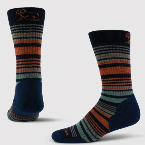 Two pairs of the "Everyday Crew Sock Light Cushion" by Woolx showcase stylish, durable designs with horizontal stripes in deep navy, orange, green, and gray. Made from moisture-wicking fabric, one sock stands upright while the other leans slightly to reveal a smaller embroidered ram's head near the top edge.