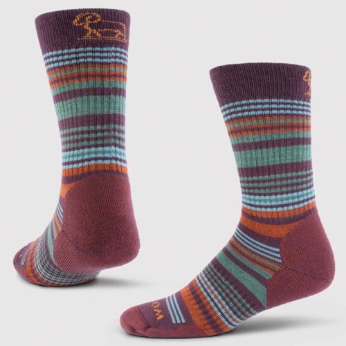 Introducing the Everyday Crew Sock Light Cushion from Woolx, featuring a vibrant Windsor Wine Stripe design with shades of purple, orange, green, and blue. These durable crew socks offer moisture-wicking properties and come with a ribbed texture on top and a subtle emblem near the cuff. Photographed against a simple white backdrop.