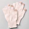 A pair of Woolx Asher Tech Gloves in an Almost Mauve shade, designed for touchscreen use with contrasting beige fingertips, is displayed flat on a light gray background. The gloves are equipped with ribbed cuffs and one glove features a small tag with the brand logo.