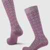 Two Tilly Over The Calf Cable Knit Socks in Wild Ginger by Woolx, made from luxurious Merino wool, feature an intricate interlocking pattern set against a solid white background.