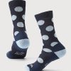 The Dotalicious Crew Socks from Woolx, available in the vibrant Navy Blue Jay color, showcase lightweight construction and a stylish design with light blue polka dots. The heels and toes are accented with light blue for added style and comfort, perfect for stocking stuffer deals!