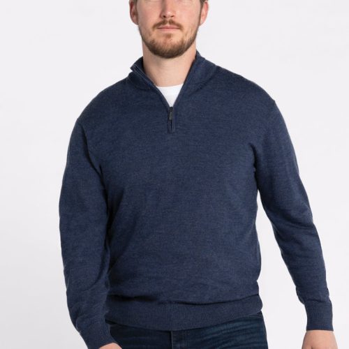 A man with short hair and a beard is wearing the Enzo Quarter Zip in Twilight Storm from Woolx and dark jeans, standing against a plain white background. | Will is 6', wearing a size M