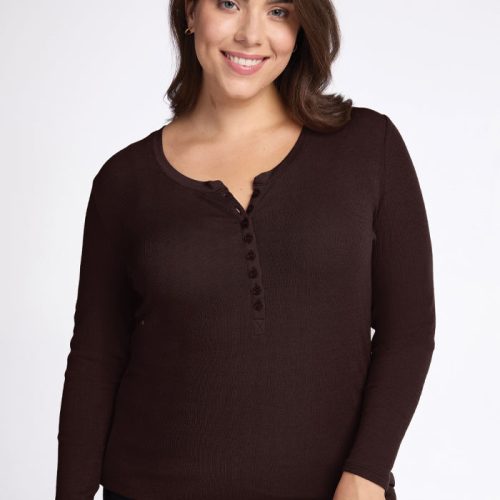 A person with long brown hair is smiling and wearing the Reese Ribbed Henley in French Roast from Woolx, made of soft Merino wool with buttons down the front. The background is plain white. | Juliana is 5'10", wearing a size XL