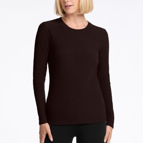 A person with short blonde hair is wearing a French Roast Hadley Ribbed Crew from Woolx, along with matching pants. The luxurious ribbed design adds an elegant texture as they stand against a white background, looking to the side. | Georgia is 5'10", wearing a size XS