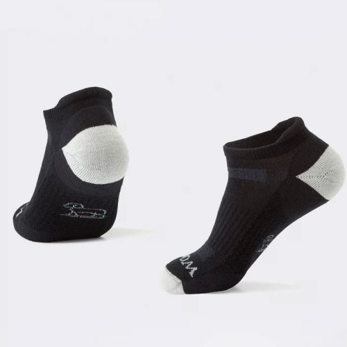 The Tempo Ankle Socks Full Cushion - Black by Woolx, made from Merino wool, are displayed against a plain white background. These black socks with gray accents on the heel and toe feature a subtle logo on the side, making them ideal for hiking and other outdoor activities.