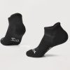 The Rowan No Show Tab Lightweight Socks in black from Woolx are displayed on a light gray background. Crafted with Merino wool, these socks feature subtle white logos near the toes and heels, offering remarkable temperature regulation and cushioned ultimate comfort.