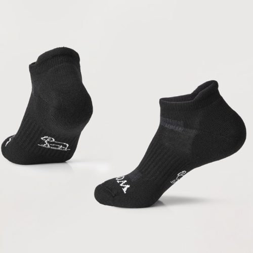 The Rowan No Show Tab Lightweight Socks in black from Woolx are displayed on a light gray background. Crafted with Merino wool, these socks feature subtle white logos near the toes and heels, offering remarkable temperature regulation and cushioned ultimate comfort.