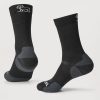 The Harbor Crew Sock Light Cushion - Black by Woolx features moisture-wicking technology, with gray heel and toe accents. A small embroidered rabbit logo is visible near the cuff of these Merino wool socks, showcased on a neutral background, providing both style and comfort.