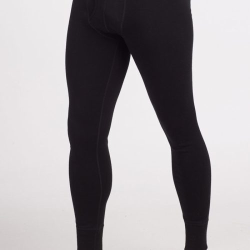 A person wearing Woolx's Backcountry Leggings in black, with "Woolx" branded on the waistband. These form-fitting Merino base layer bottoms extend down to the ankles and are ideal for cold weather adventures, featuring luxurious Australian Merino Wool. The person is standing barefoot on a plain white background. | Terrence is 6'3", wearing a size L