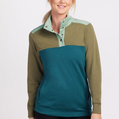 A person wearing an Olive Teal Charlie Pullover by Woolx stands against a plain background, smiling. The pullover, part of the Stocking Stuffer Final Sale Deals, features buttons on the collar and long sleeves, made with soft DuraLite Merino wool for added comfort.